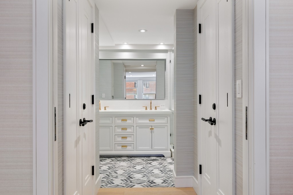433 West 34th Street, Unit 4ABC Manhattan, NY 10001 - Photo 12 of 20 a bathroom with a sink and a mirror