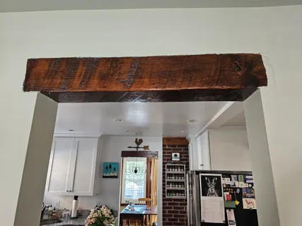 a room with a window and a ceiling fan