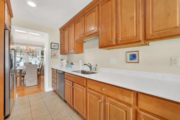 a kitchen with stainless steel appliances granite countertop a sink and cabinets