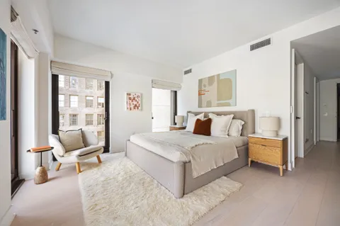 a bathroom with a sink double vanity and a shower