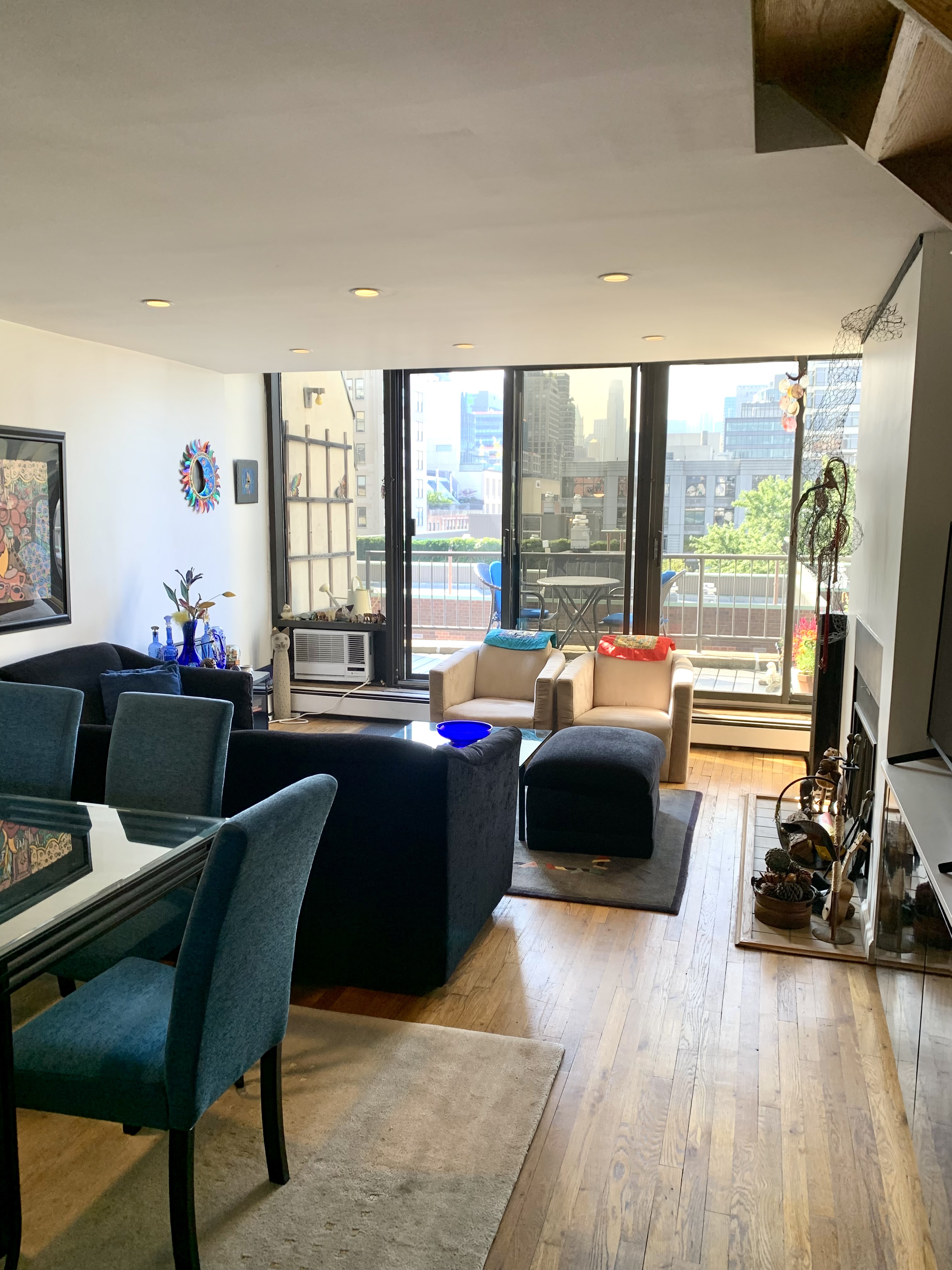 130 Barrow Street, Unit PH508 Manhattan, NY 10014 - Photo 2 of 14 a living room with furniture and a large window