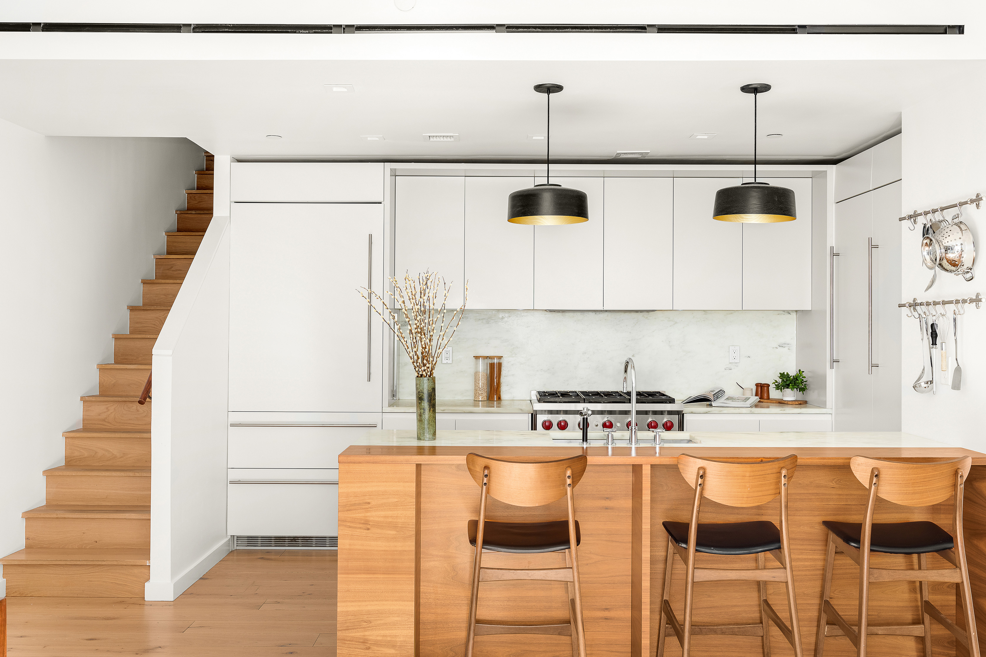 280 Saint Marks Avenue, Unit TH-E Brooklyn, NY 11238 - Photo 4 of 10 a kitchen with stainless steel appliances kitchen island granite countertop a sink and a cabinets