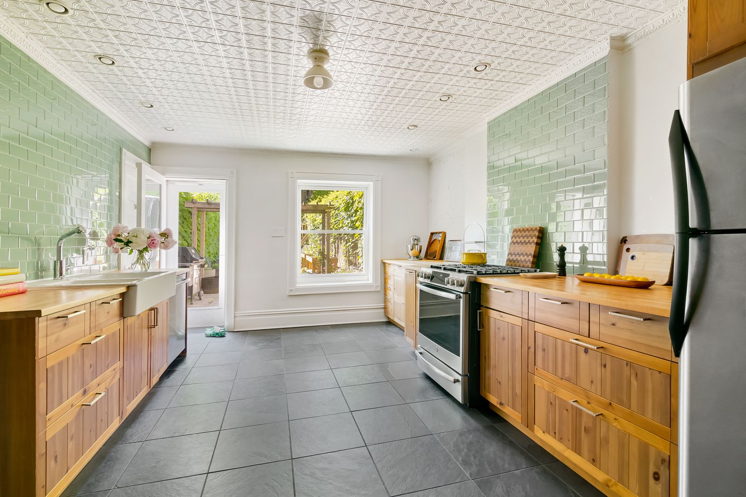 856 St Johns Place Brooklyn, NY 11216 - Photo 5 of 14 a large kitchen with a stove a sink dishwasher and a refrigerator