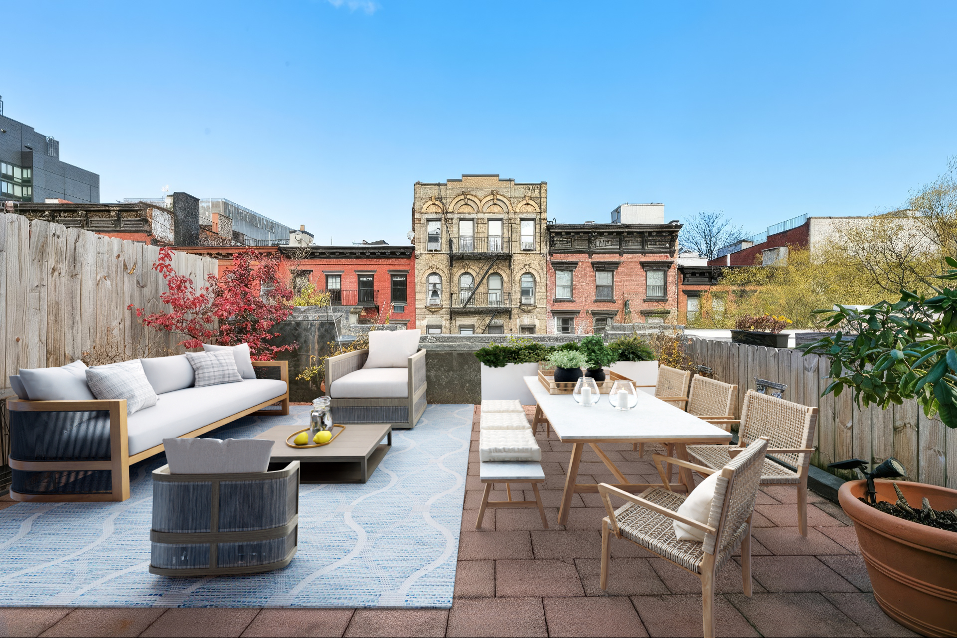 220 East 5th Street, Unit PHE Manhattan, NY 10003 - Photo 7 of 11 a view of a terrace with furniture and a fire pit