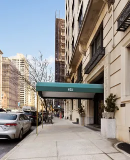 a view of a building with car parked