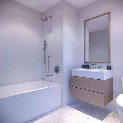 21-30 44th Drive, Unit 7D Queens, NY 11101 - Photo 6 of 14 a bathroom with a sink mirror vanity and a bathtub