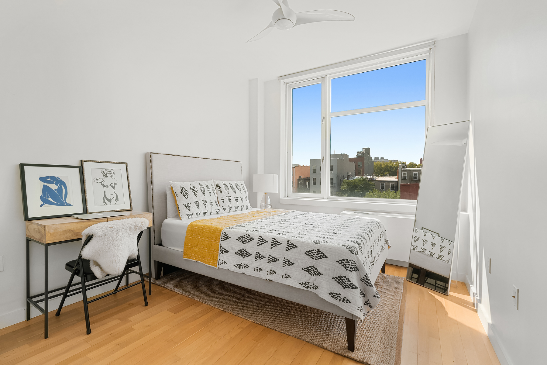 1 Powers Street, Unit 404 Brooklyn, NY 11211 - Photo 4 of 14 a bedroom with a bed and a window