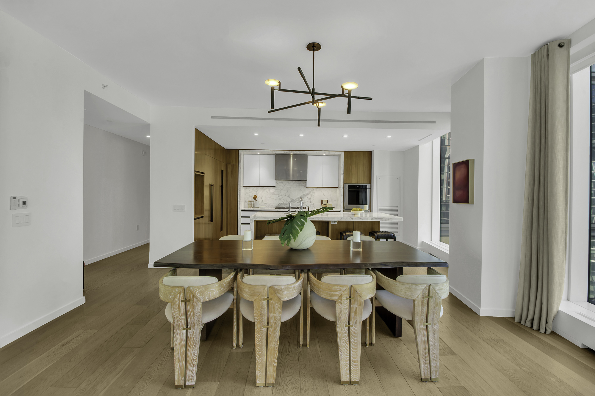 1 West End Avenue, Unit 10A Manhattan, NY 10023 - Photo 9 of 38 a view of a dining room with furniture and wooden floor