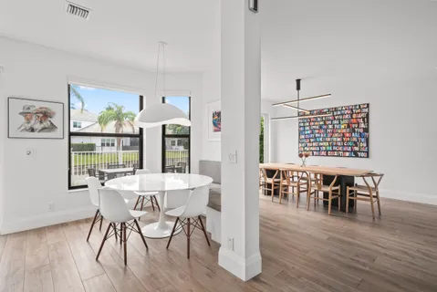 a bathroom with a double vanity sink a mirror and a shower