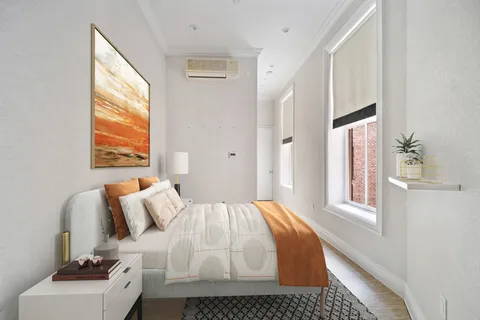 a bathroom with a sink mirror and a bathtub