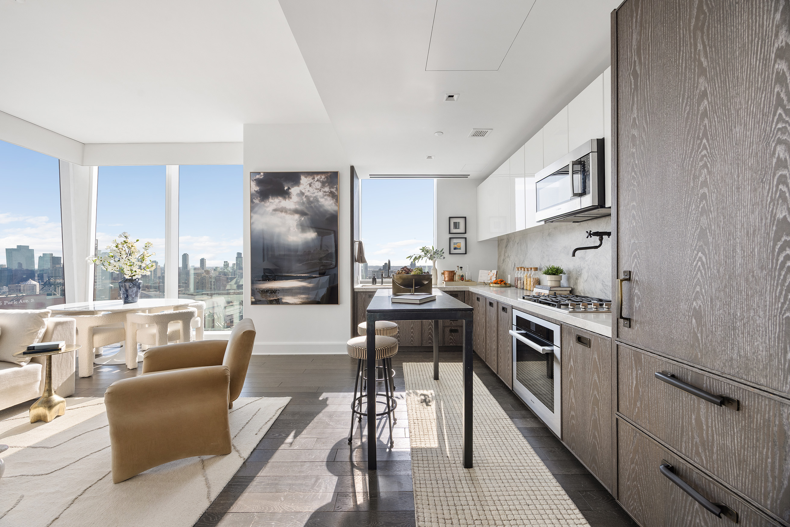 45 East 22nd Street, Unit 32B Manhattan, NY 10010 - Photo 5 of 36 a kitchen with granite countertop lots of counter top space and stainless steel appliances