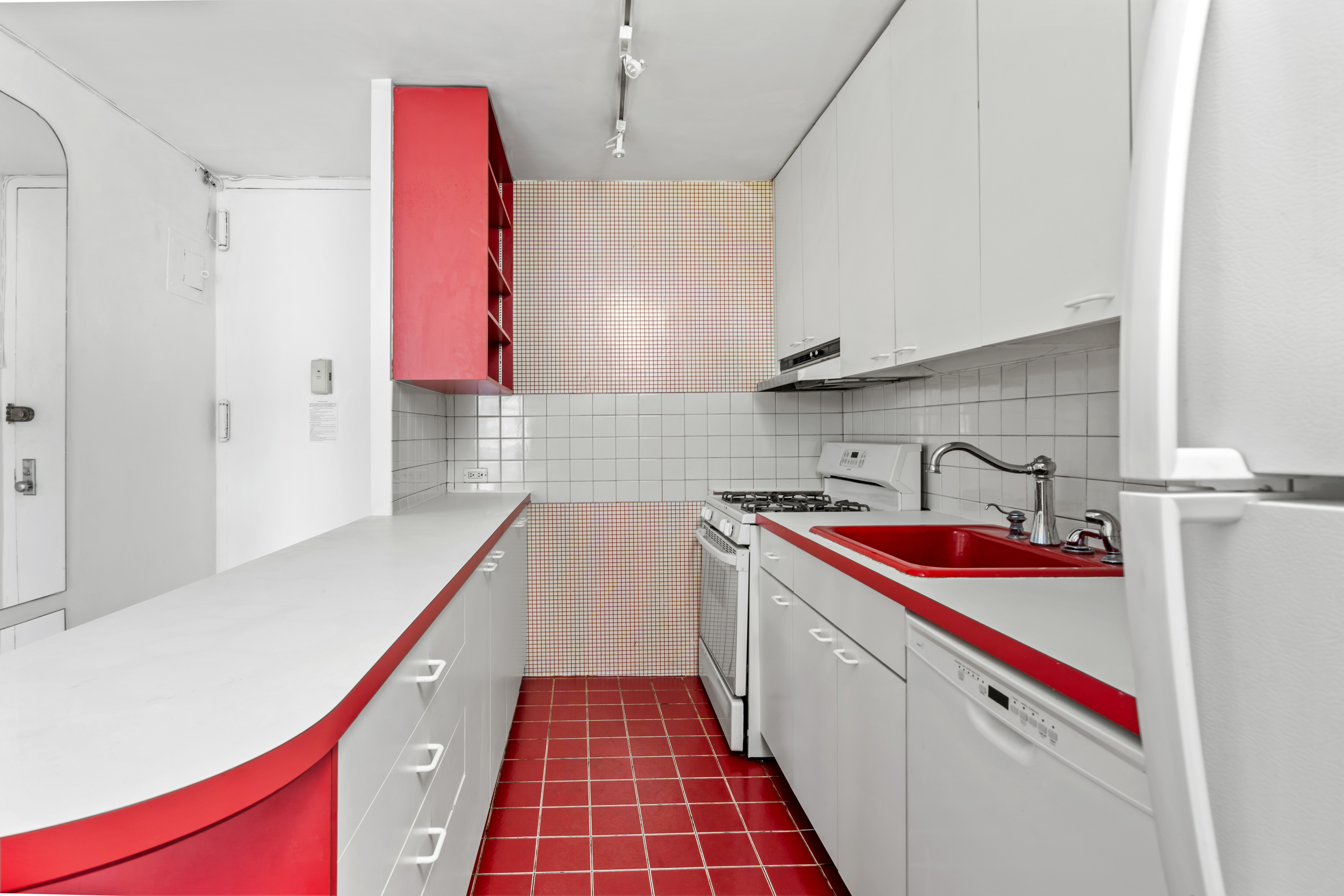 333 East 30th Street, Unit 18N Manhattan, NY 10016 - Photo 6 of 18 a kitchen with a sink and cabinets