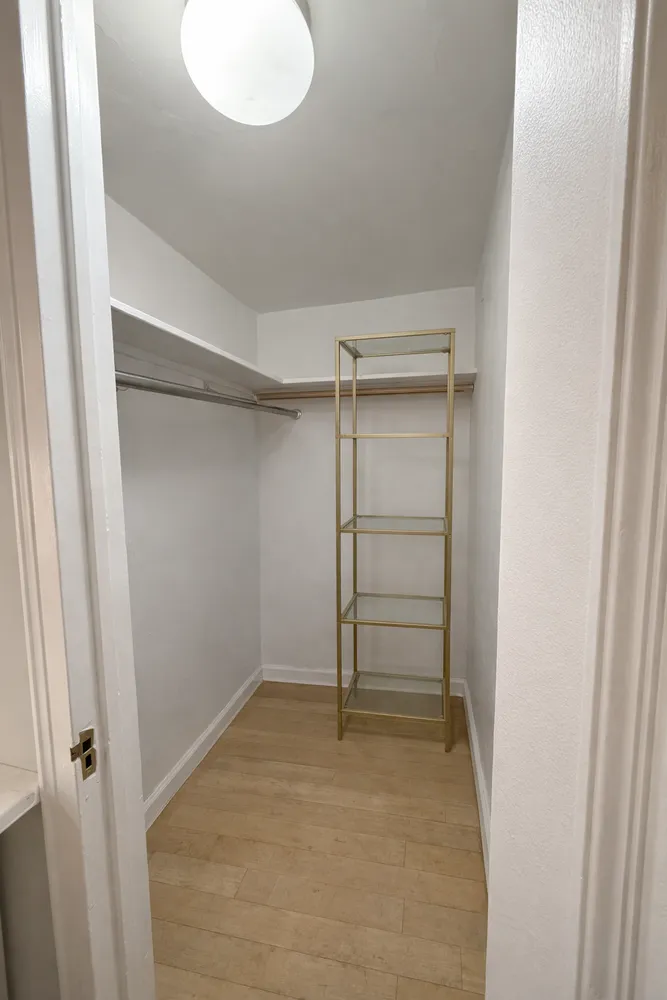 a view of an empty walk in closet