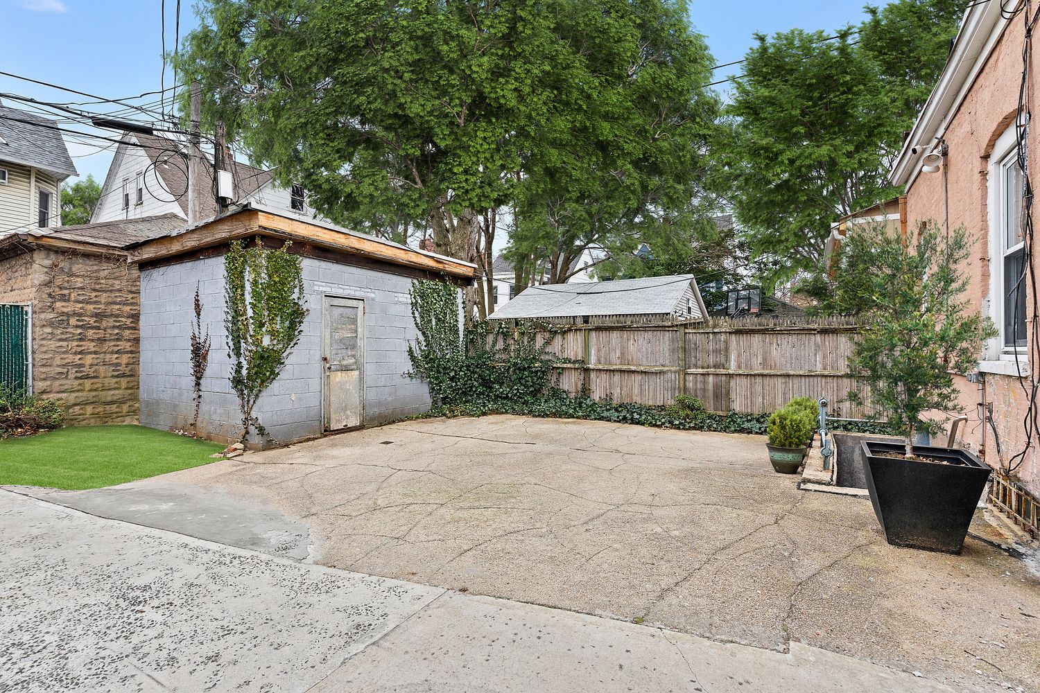 825 East 21st Street Brooklyn, NY 11210 - Photo 18 of 22 a view of a house with a yard and plants
