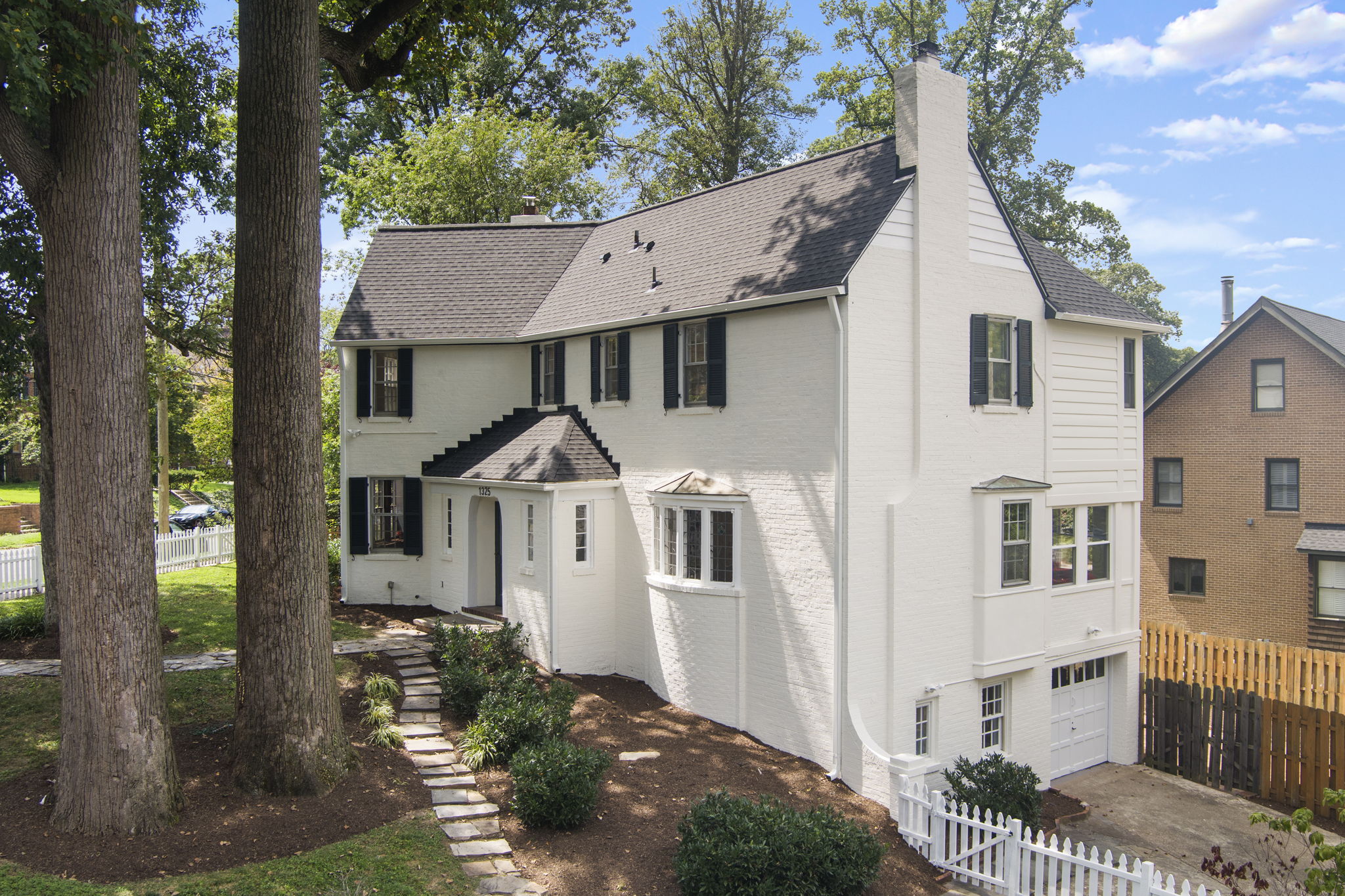 1325 Locust Road Northwest Washington, DC 20012 - Photo 3 of 56 a front view of a house with a yard