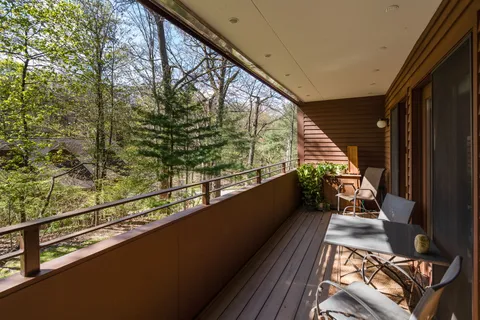 a view of balcony with furniture