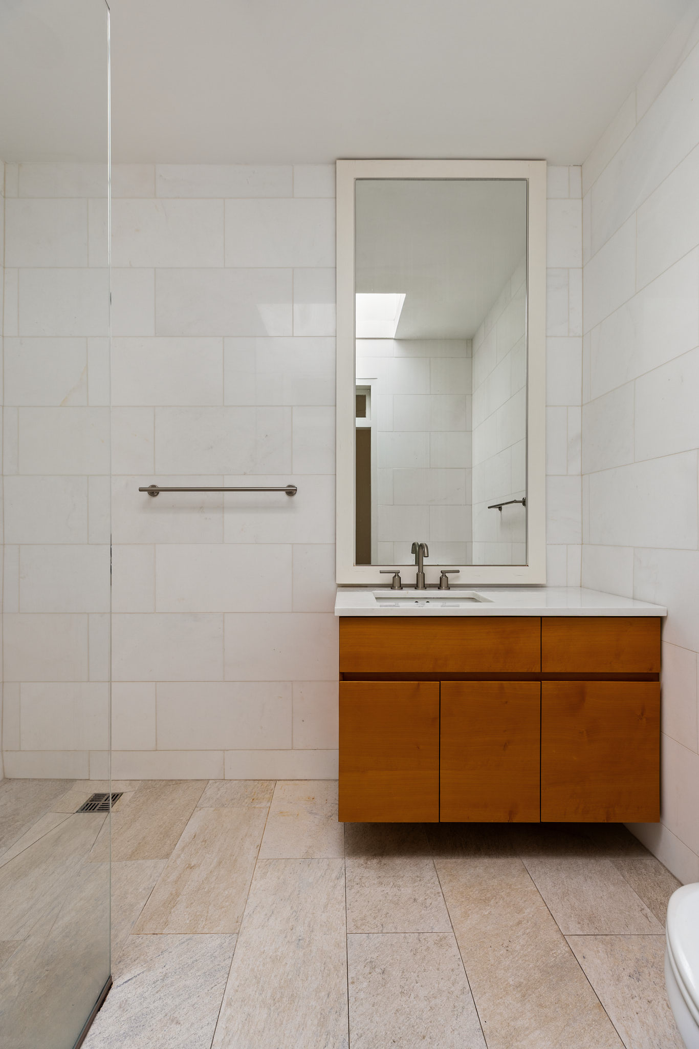 13 Vandam Street Manhattan, NY 10014 - Photo 19 of 26 a bathroom with a tub sink and mirror