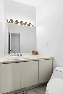 a bathroom with a sink and mirror