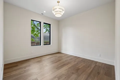 a balcony with furniture and a potted plant