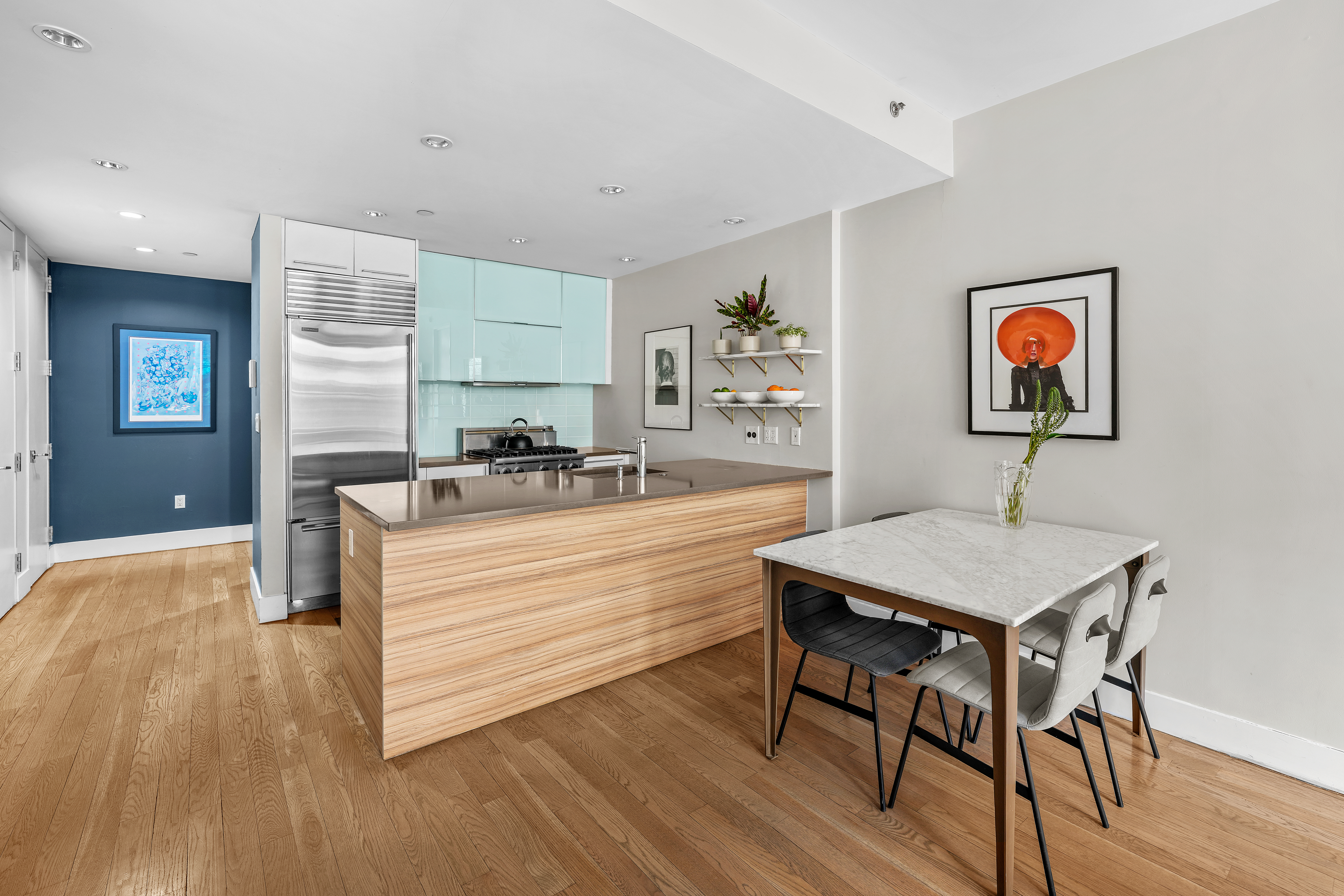 117 West 123rd Street, Unit 1B Manhattan, NY 10027 - Photo 6 of 25 a room with a table chairs and wooden floor