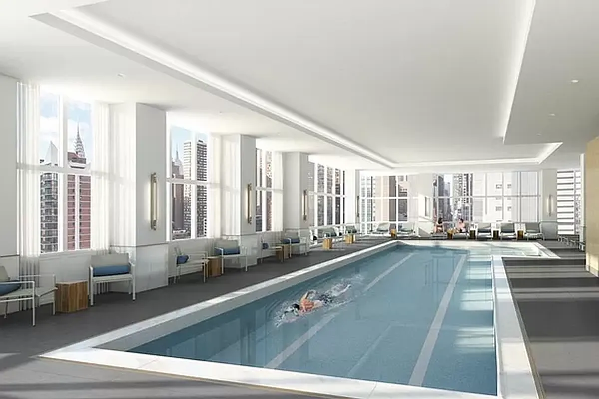 305 East 51st Street, Unit 14F Manhattan, NY 10022 - Photo 14 of 19 a lobby with furniture and large windows