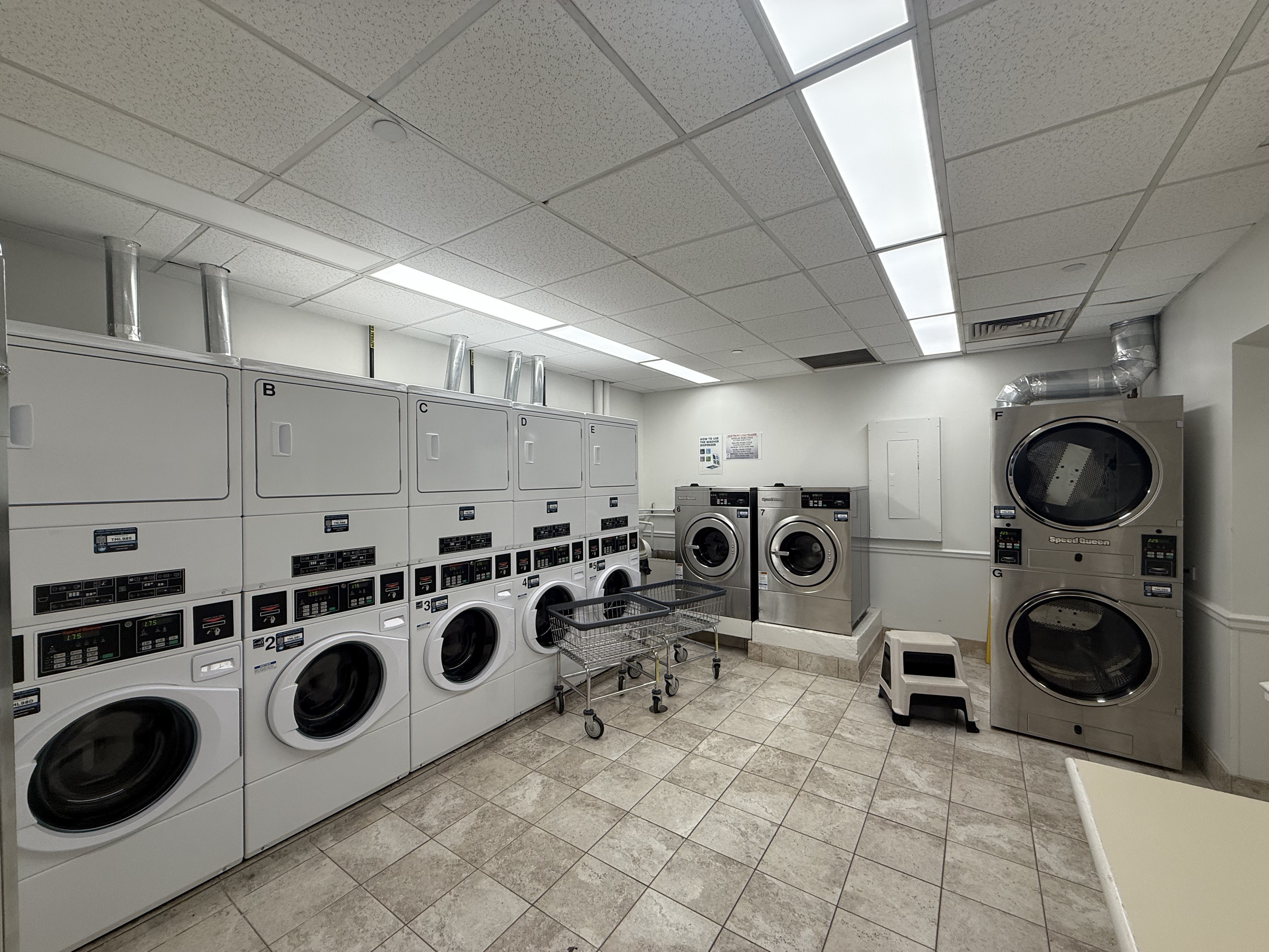 111 West 67th Street, Unit 22K Manhattan, NY 10023 - Photo 10 of 14 a utility room with dryer washer and other