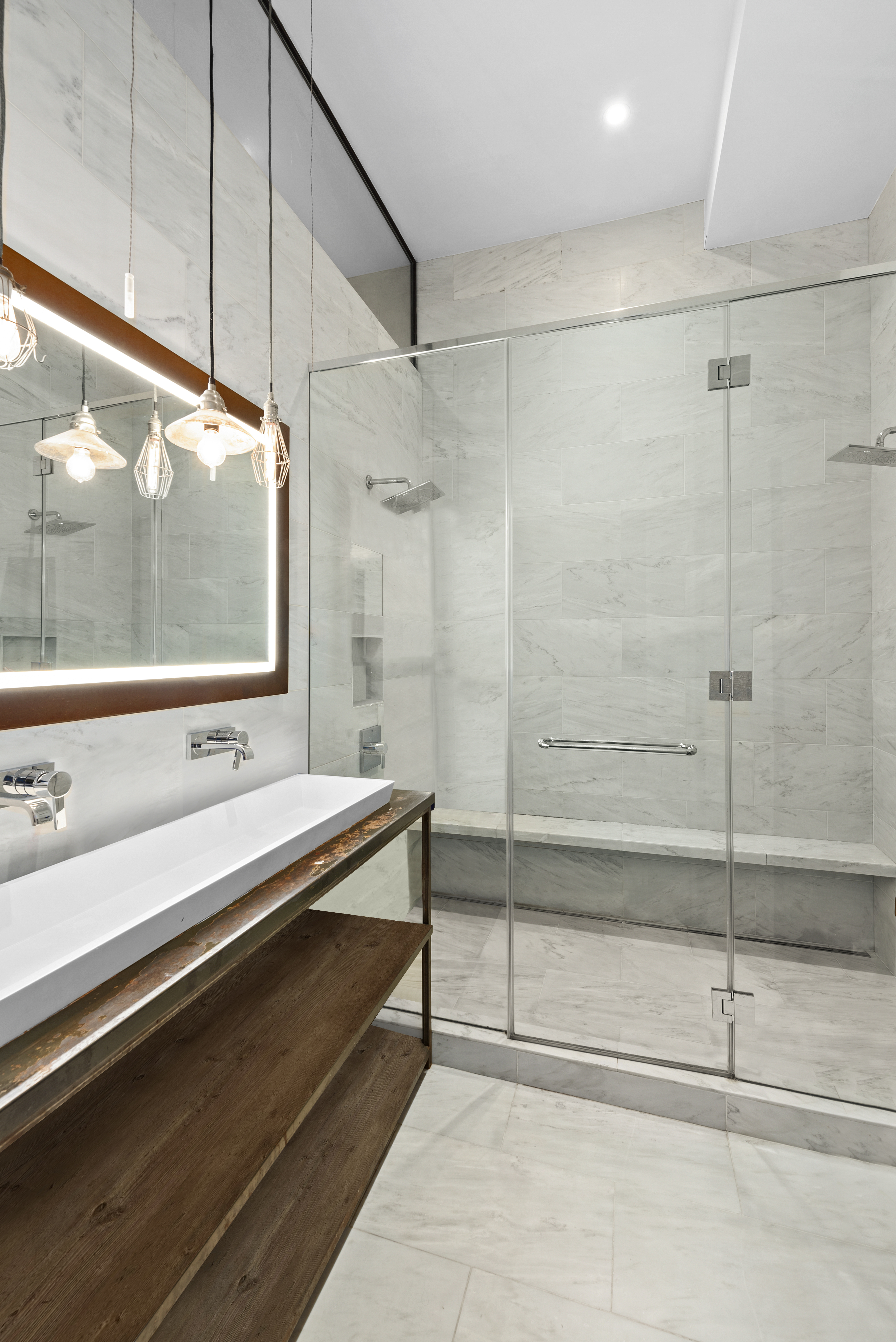 10 Bleecker Street, Unit 1B Manhattan, NY 10012 - Photo 6 of 16 a bathroom with a shower and a sink