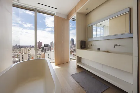 a bedroom with a bed and a night stand