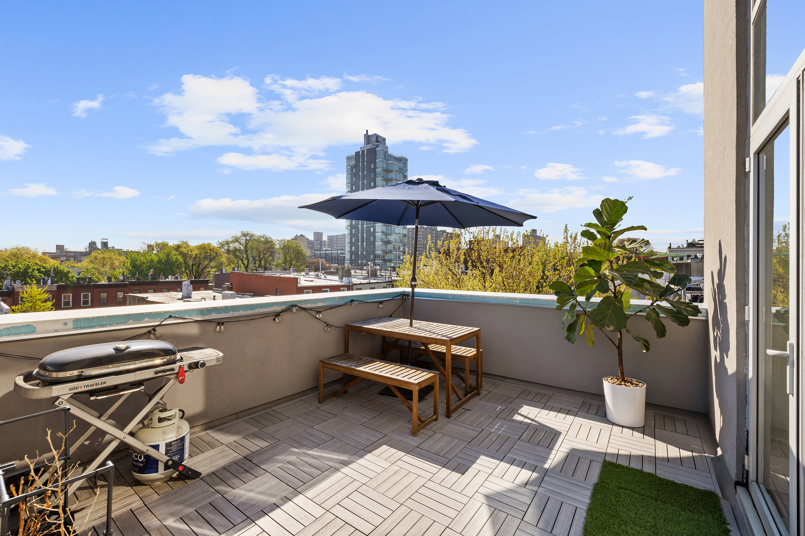 109 Waverly Avenue, Unit 4B Brooklyn, NY 11205 - Photo 5 of 14 a view of a patio with furniture and a yard