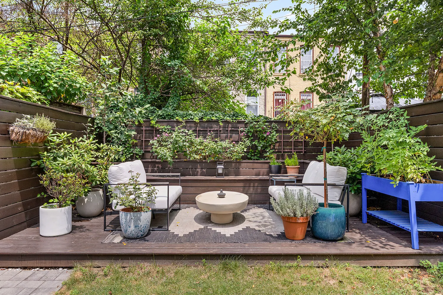 a view of swimming pool with outdoor seating and plants