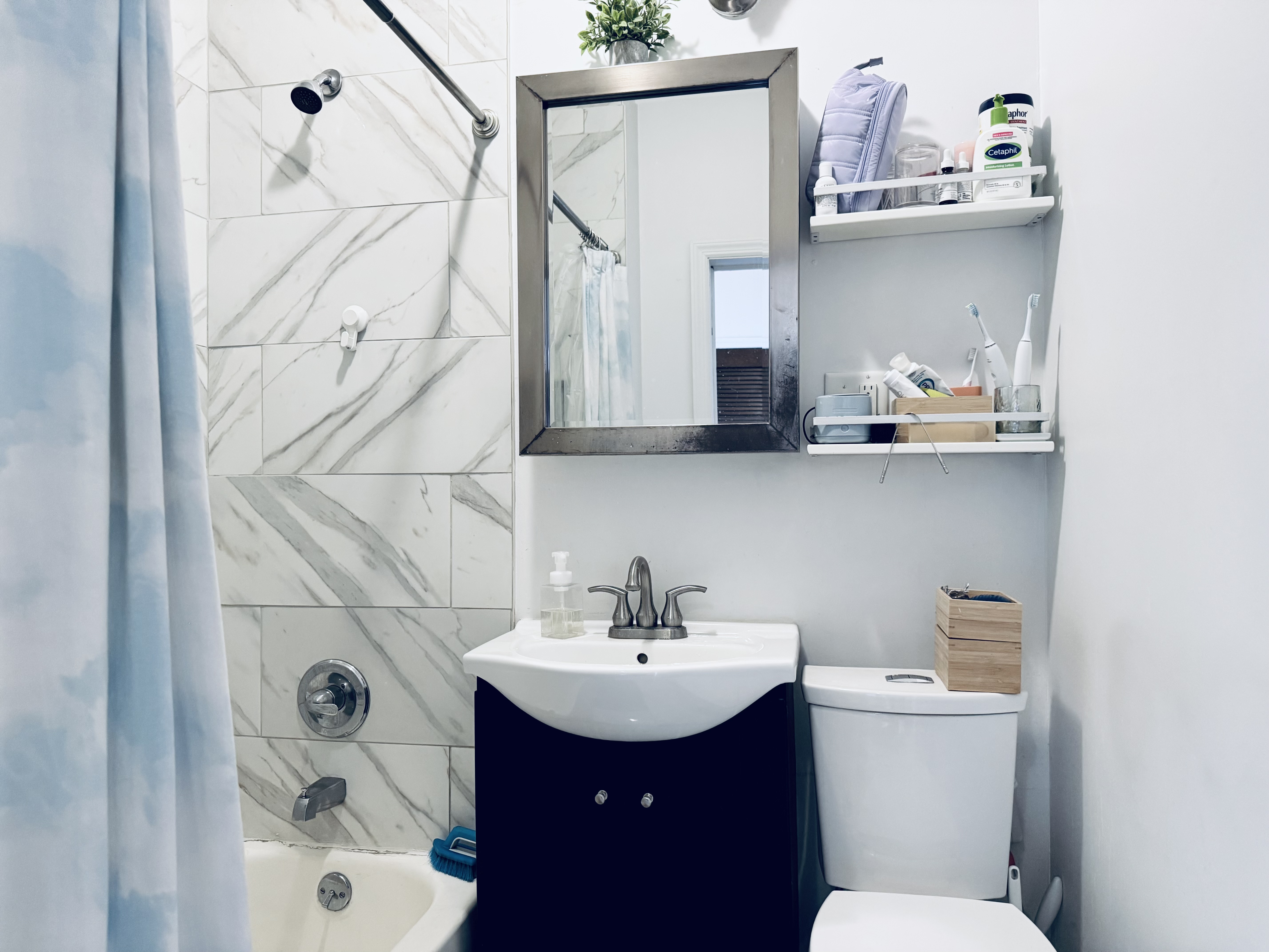 540 4th Avenue, Unit 3 Brooklyn, NY 11215 - Photo 8 of 8 a bathroom with a sink a toilet and mirror