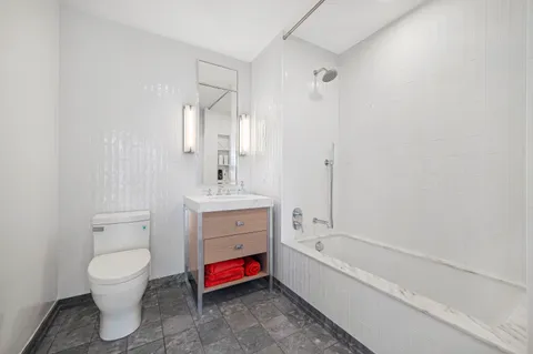 a bathroom with a toilet sink and bathtub