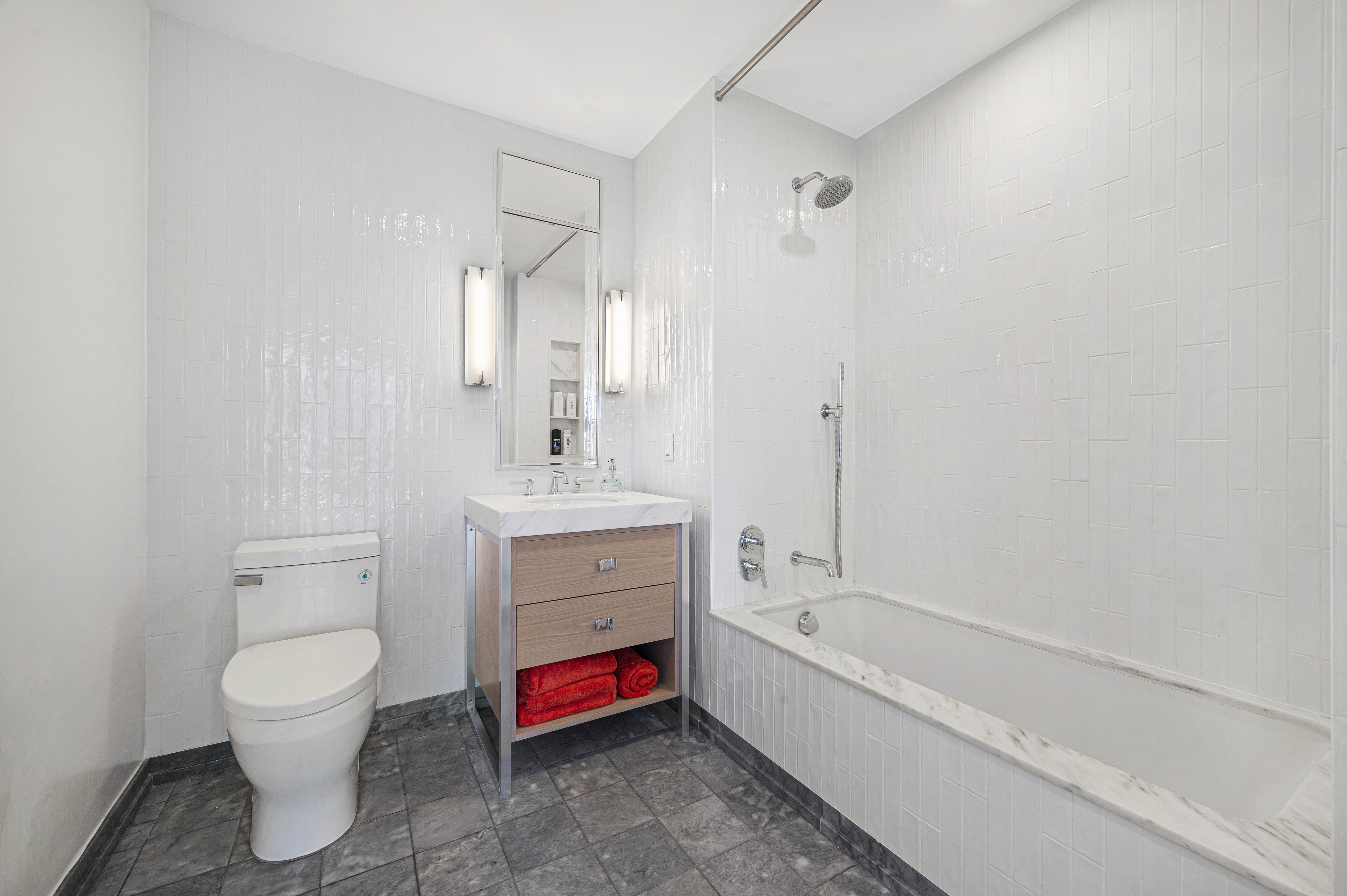 368 3rd Avenue, Unit 11A Manhattan, NY 10016 - Photo 8 of 17 a bathroom with a toilet sink and bathtub