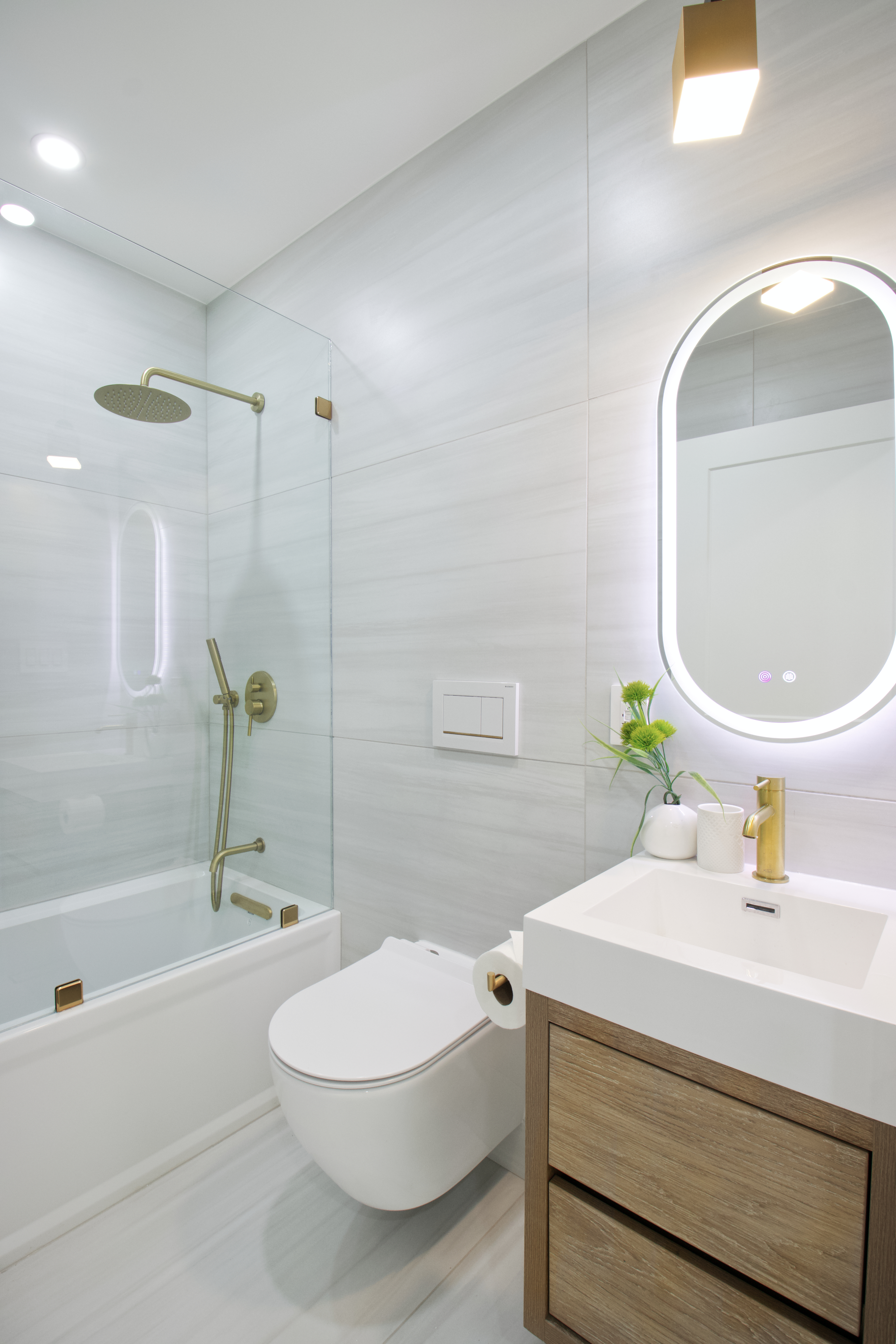 255 Macon Street Brooklyn, NY 11216 - Photo 27 of 36 a bathroom with a sink a toilet and shower