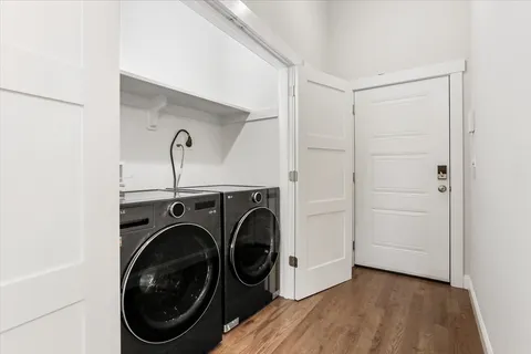 a view of a storage & utility room with washer and dryer
