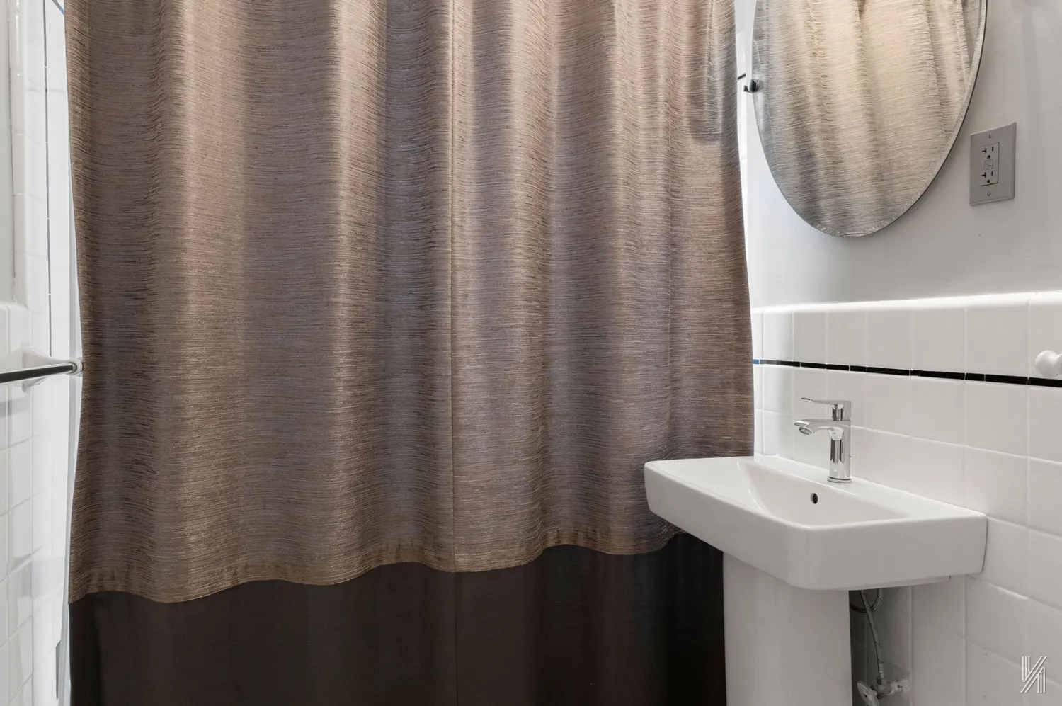 a bathroom with a sink and mirror