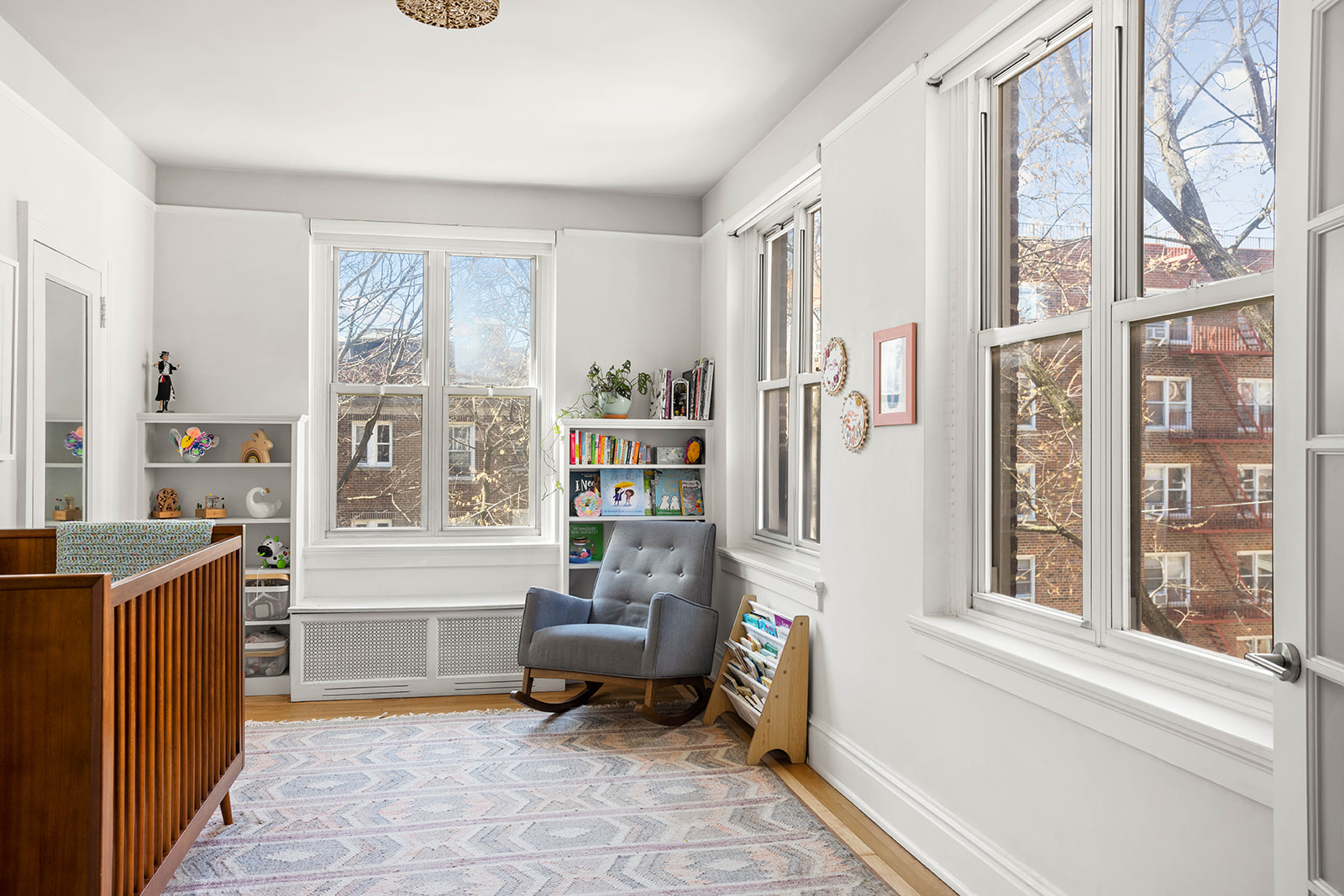 34-28 80th Street, Unit 41 Queens, NY 11372 - Photo 10 of 15 a living room with furniture and a window
