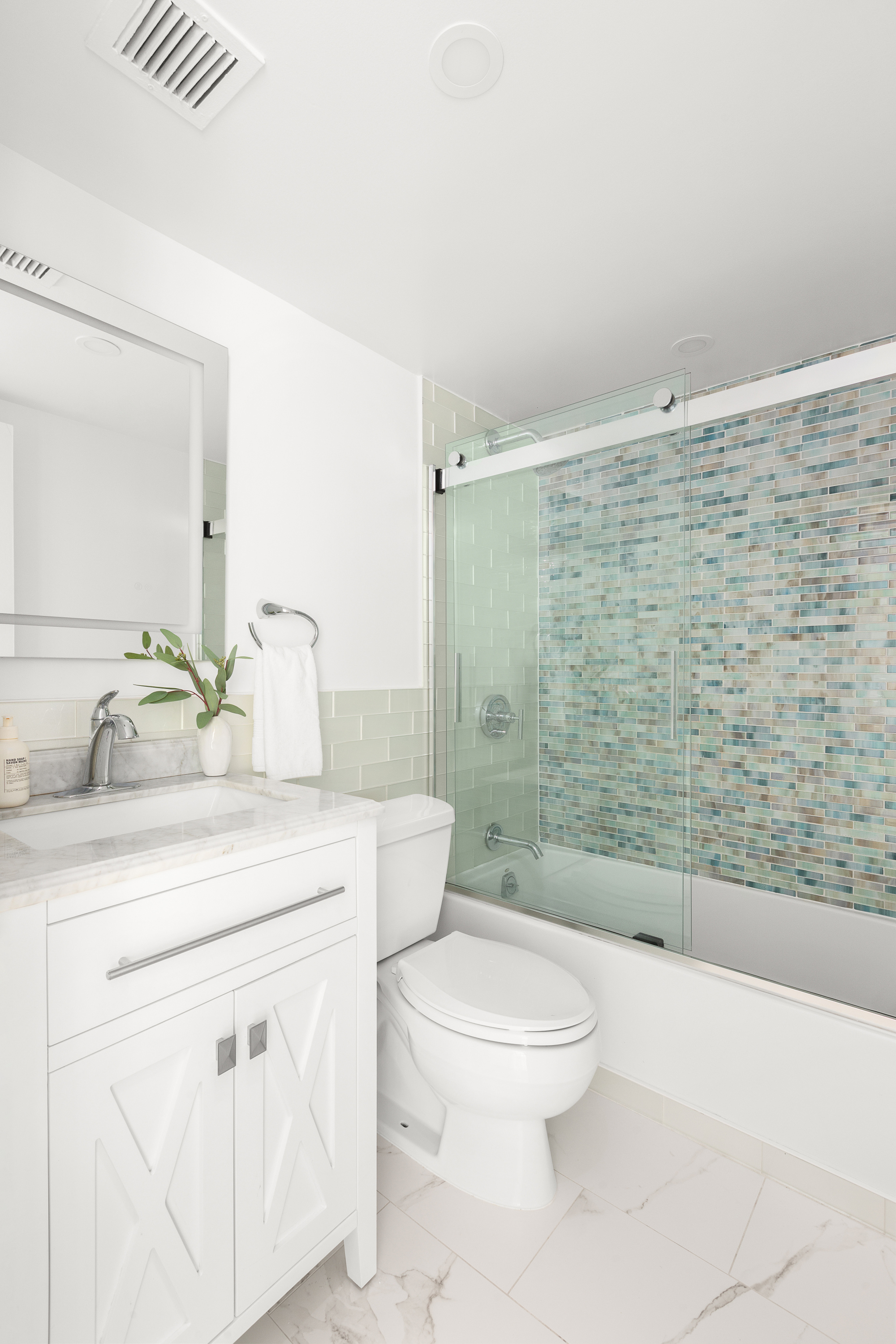 250 Mercer Street, Unit C415 Manhattan, NY 10012 - Photo 6 of 11 a bathroom with a sink a toilet and shower