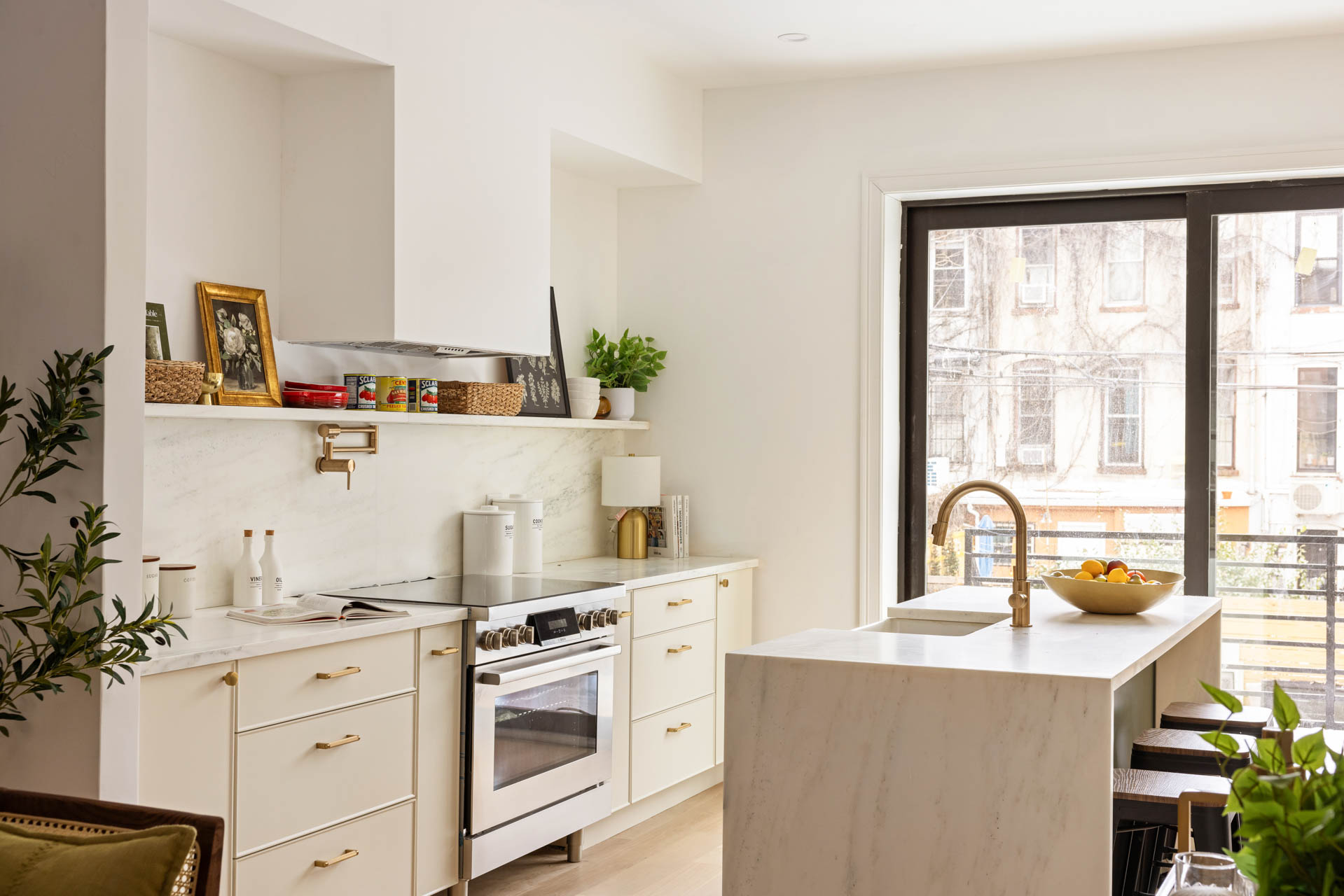 819 Greene Avenue Brooklyn, NY 11221 - Photo 5 of 14 a kitchen with a stove a sink and a refrigerator
