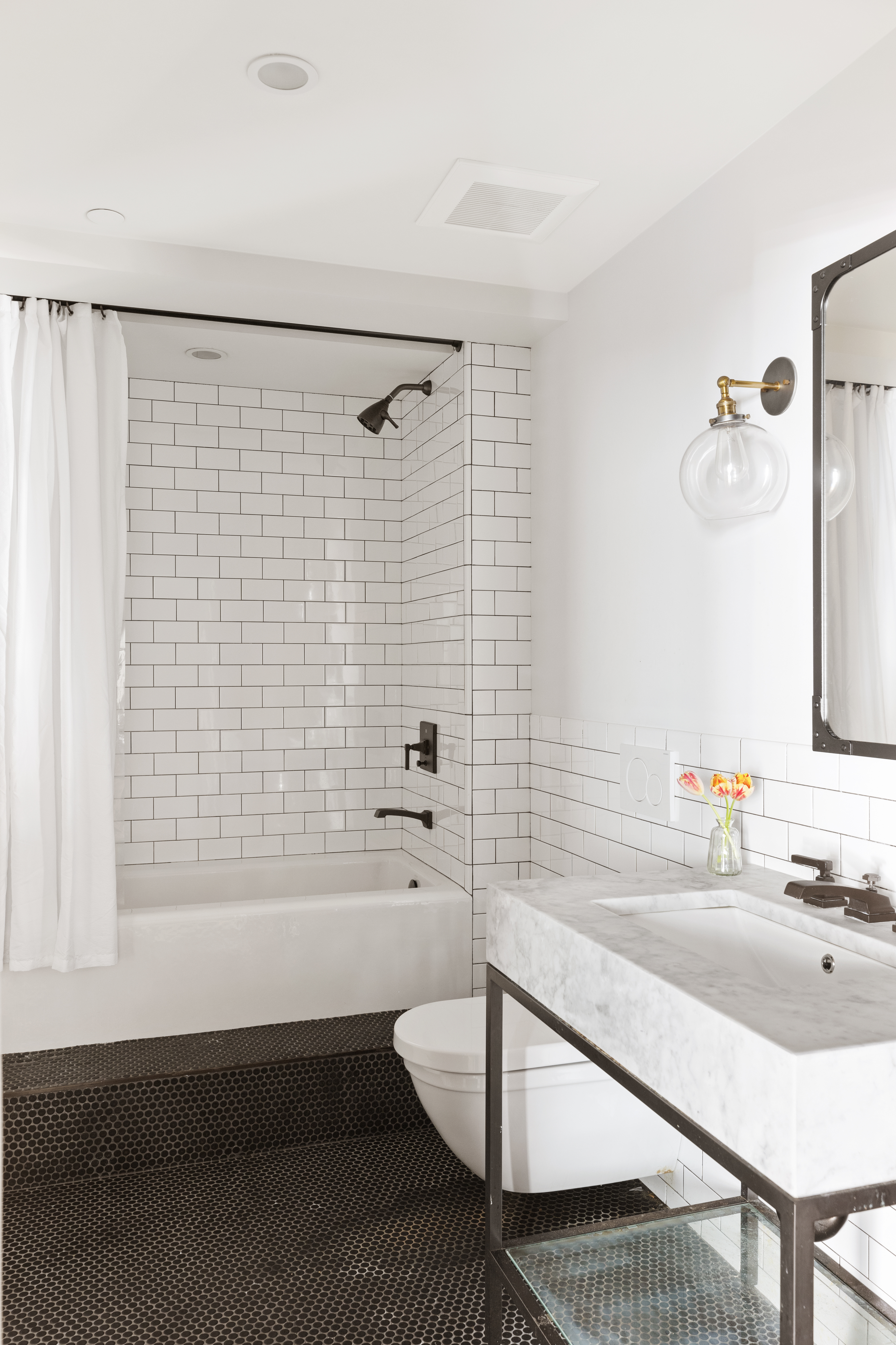 466 Washington Street, Unit 3W Manhattan, NY 10013 - Photo 12 of 14 a bathroom with a sink and a bathtub