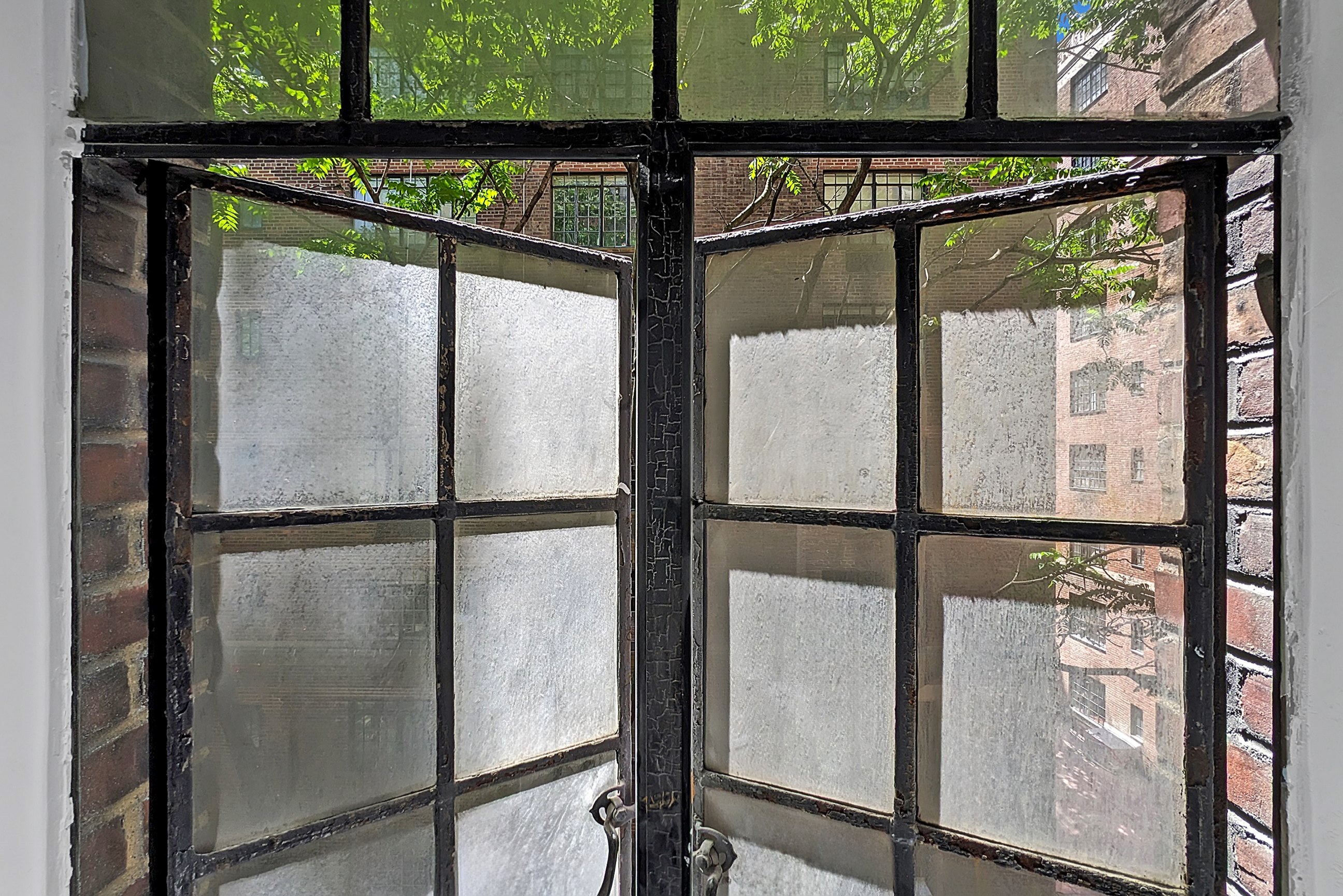 320 East 42nd Street, Unit 516 Manhattan, NY 10017 - Photo 4 of 11 a view of a glass entrance