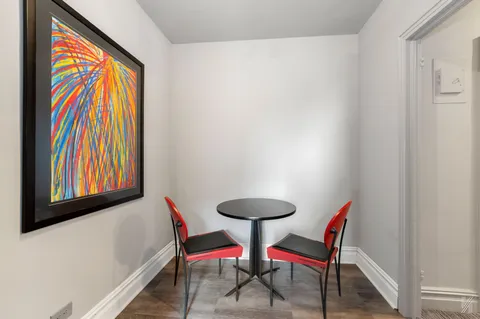 a view of a room with a table and a chair