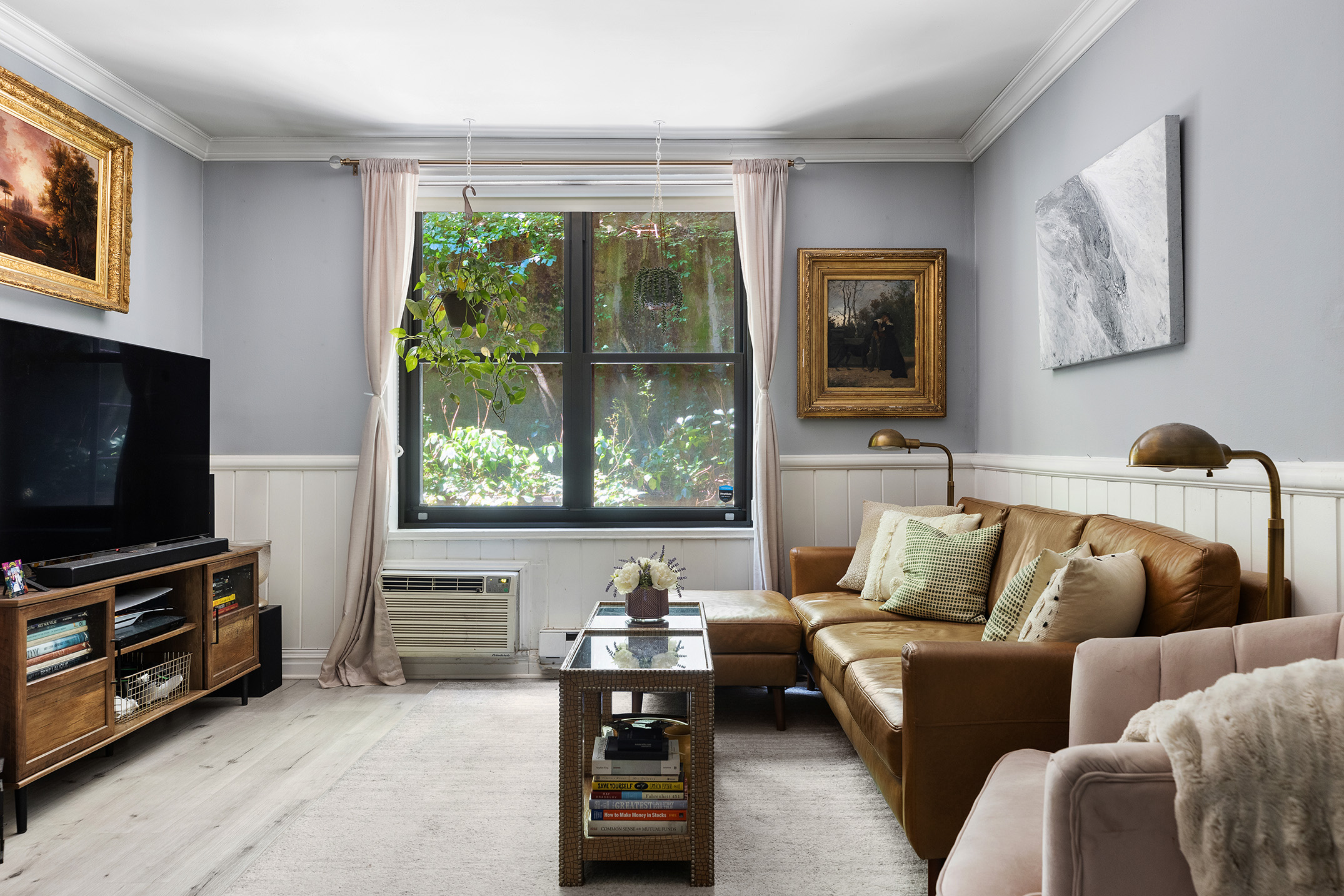 45 Overlook Terrace, Unit 3A Manhattan, NY 10033 - Photo 3 of 9 a living room with furniture and a flat screen tv