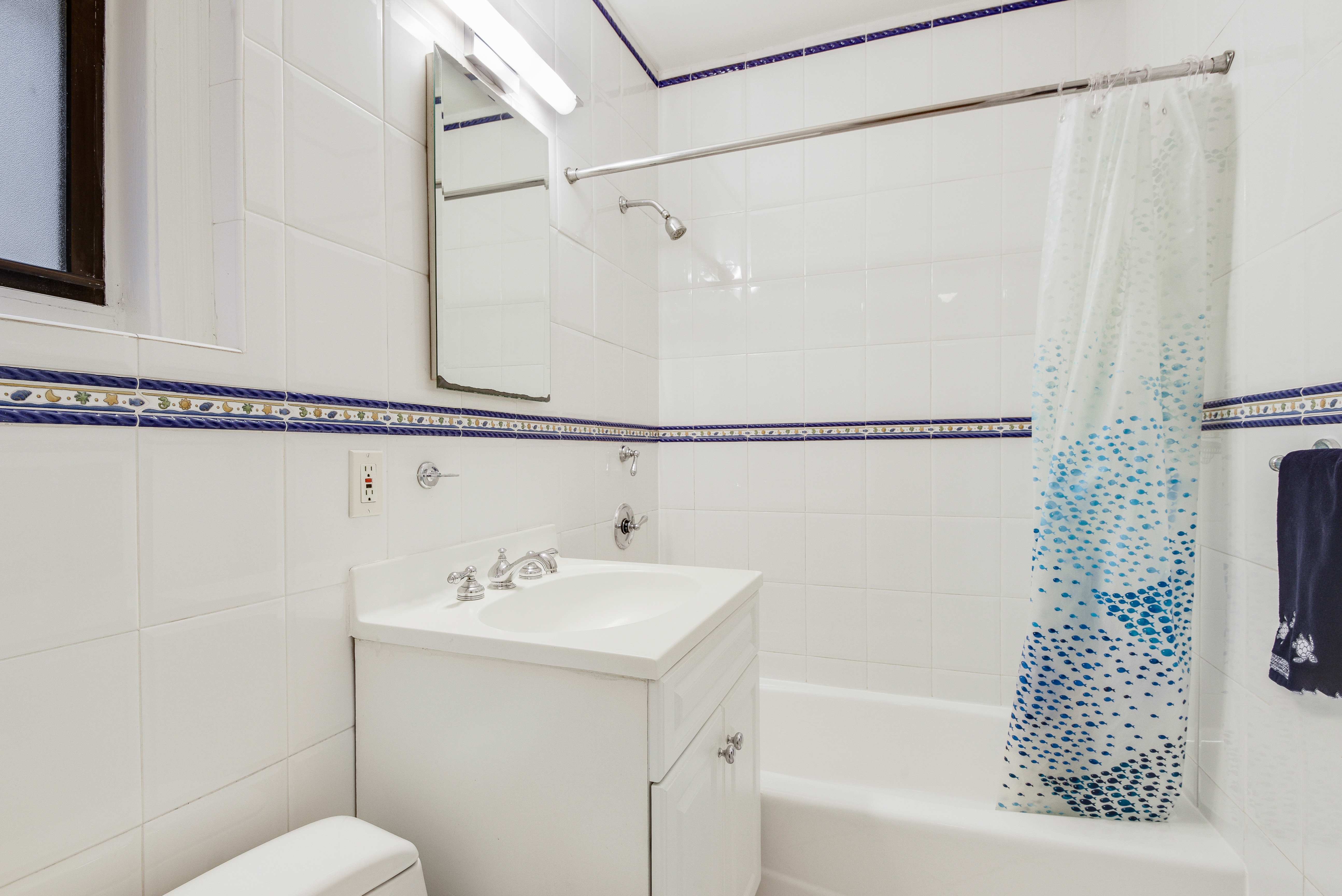321 West 90th Street, Unit 2F Manhattan, NY 10024 - Photo 13 of 16 a bathroom with a sink and a bathtub