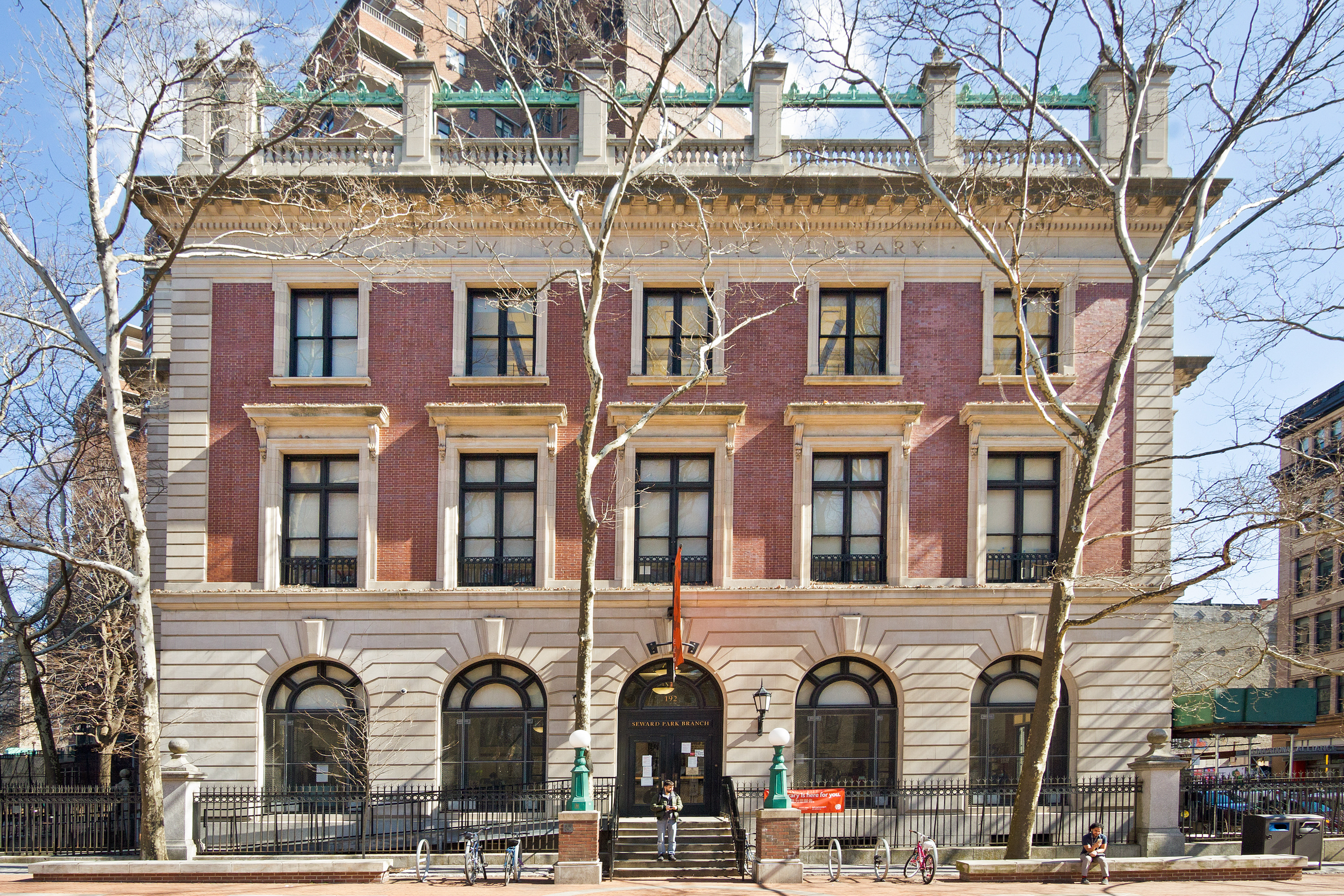 417 Grand Street, Unit D1801 Manhattan, NY 10002 - Photo 21 of 23 a front view of a building with many windows