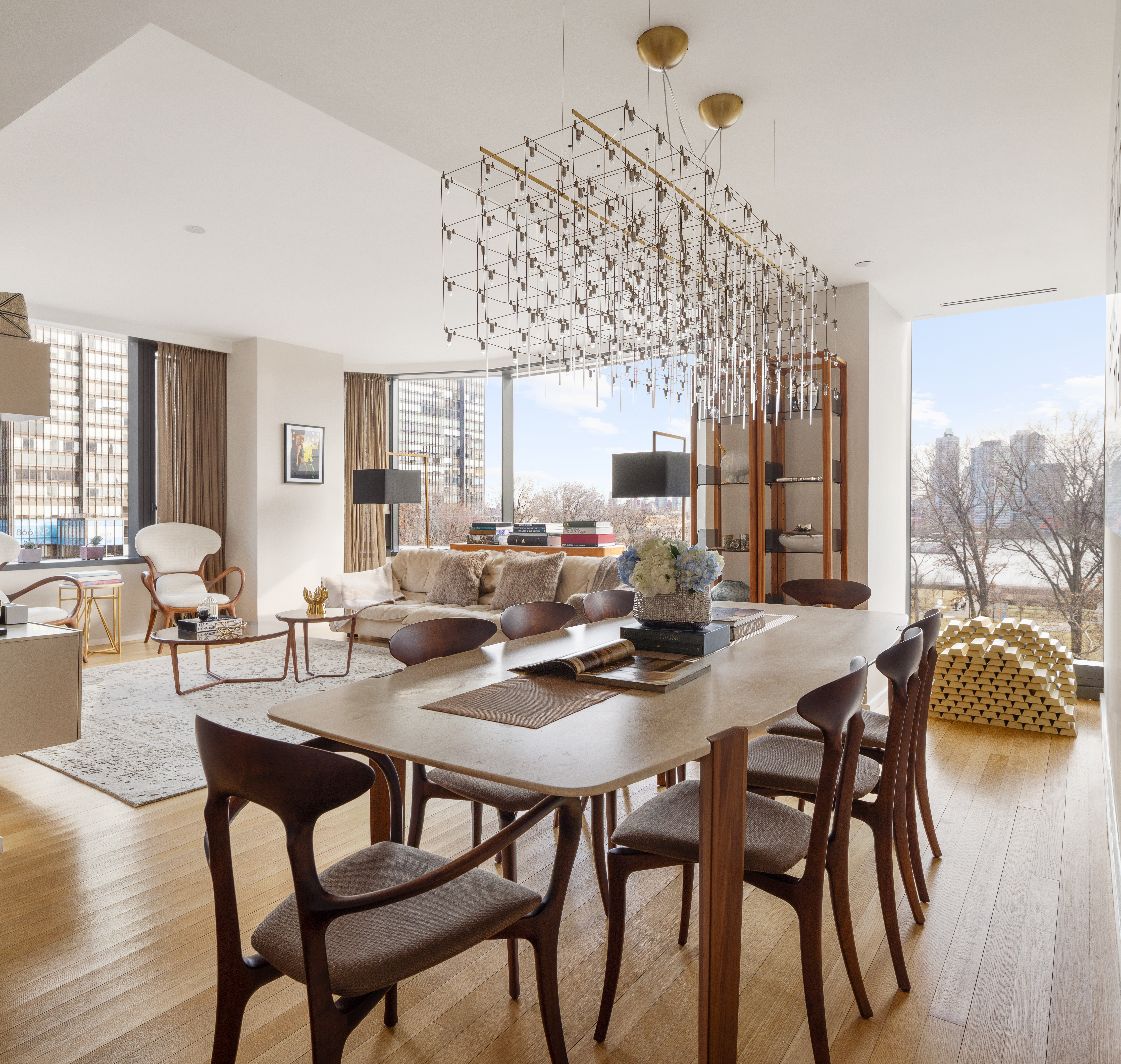 50 United Nations Plaza, Unit 6B Manhattan, NY 10017 - Photo 2 of 13 a view of a dining room with furniture and wooden floor