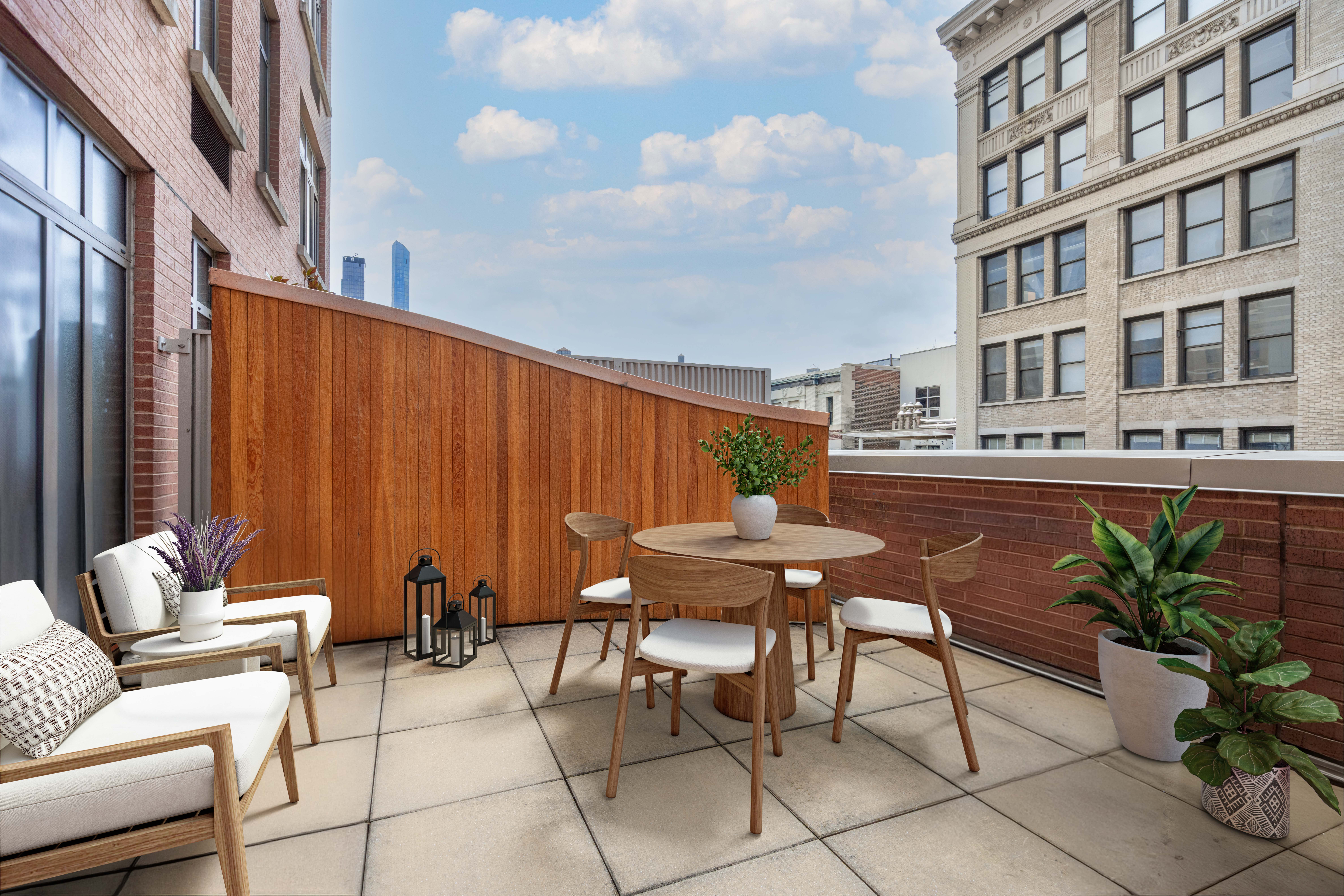 125 West 22nd Street, Unit 10A Manhattan, NY 10011 - Photo 3 of 11 a backyard of a house with table and chairs