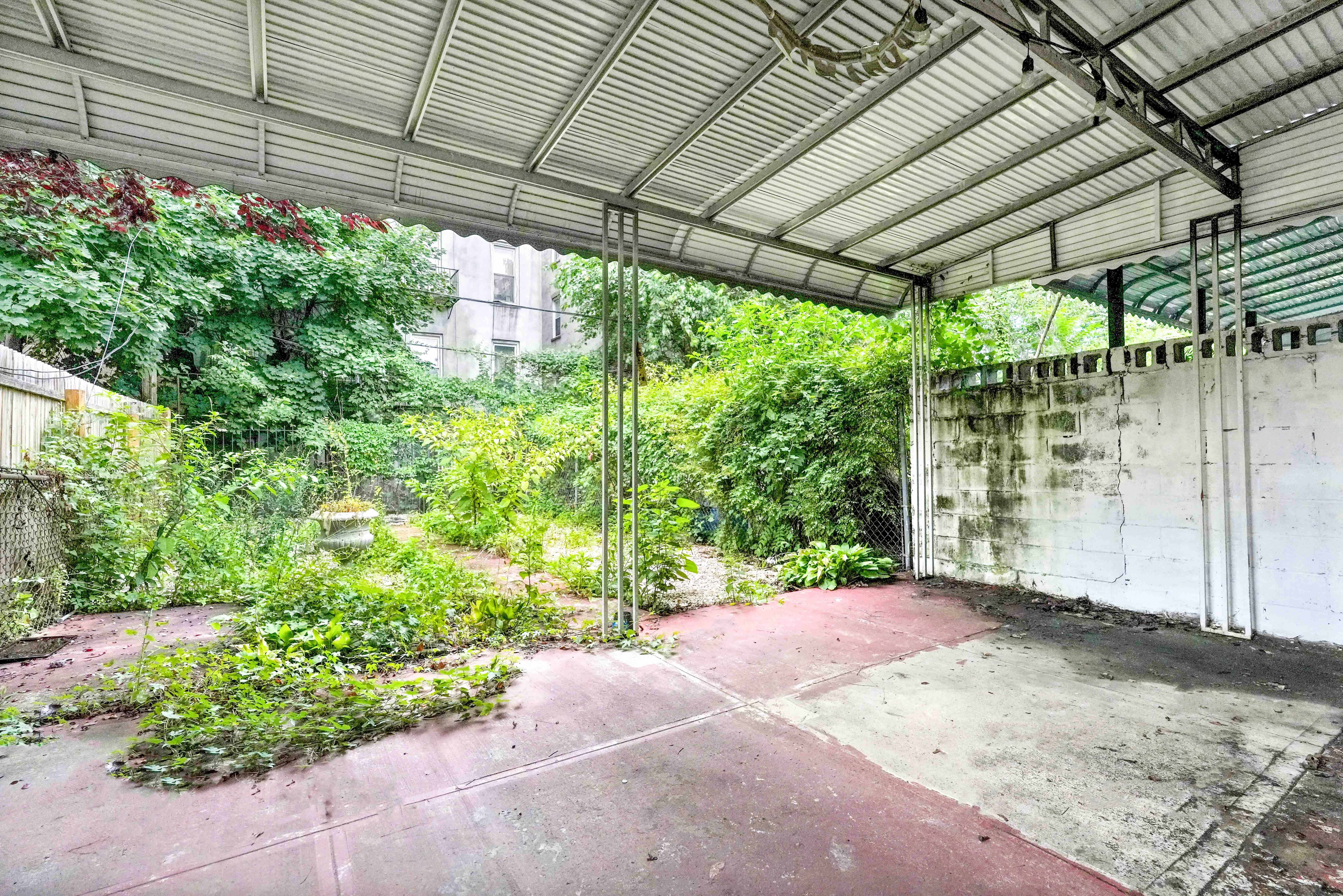 278 Lefferts Avenue Brooklyn, NY 11225 - Photo 51 of 56 a view of a backyard with a large tree