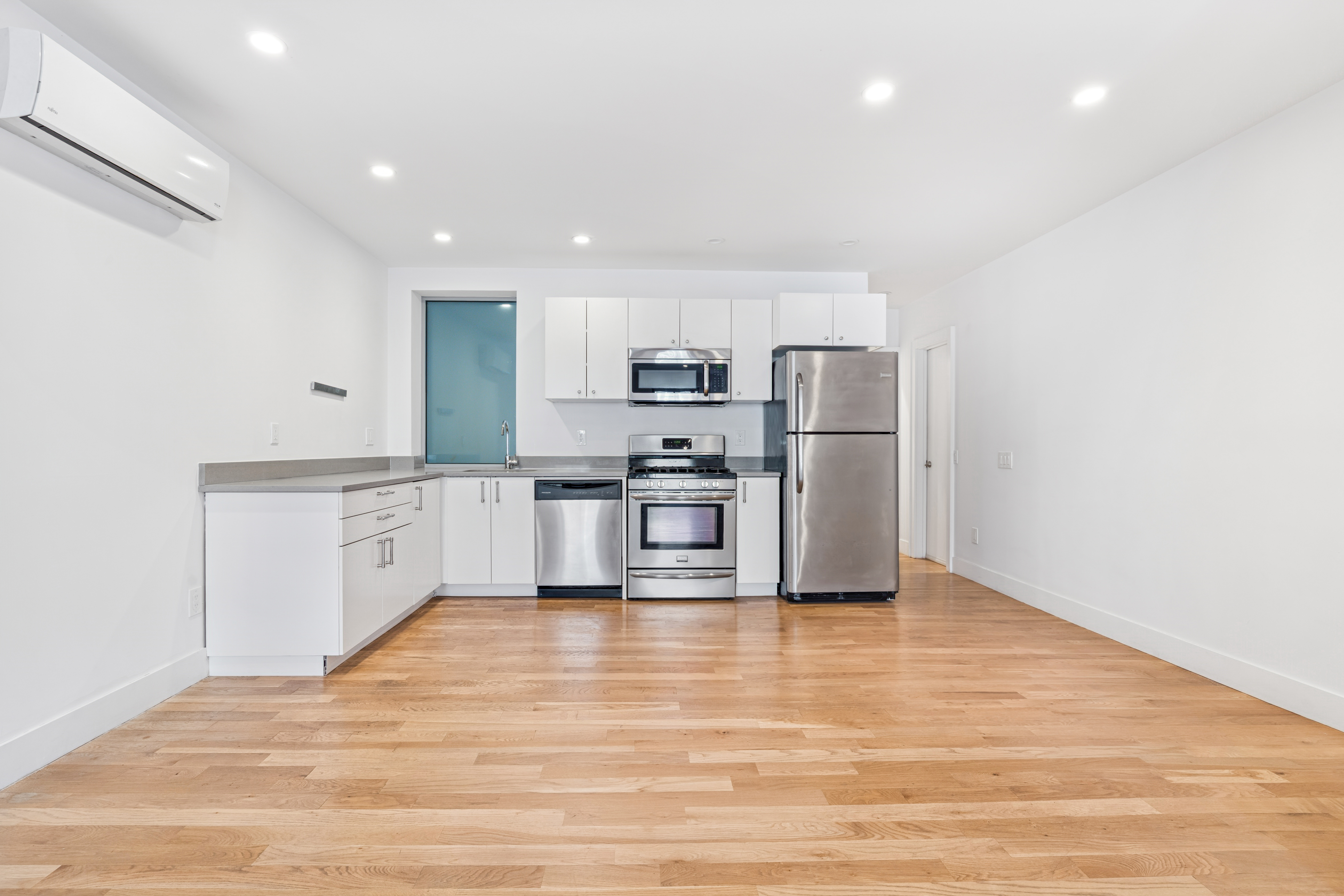 1515 11th Avenue, Unit 1 Brooklyn, NY 11215 - Photo 3 of 11 a kitchen with a refrigerator and a sink