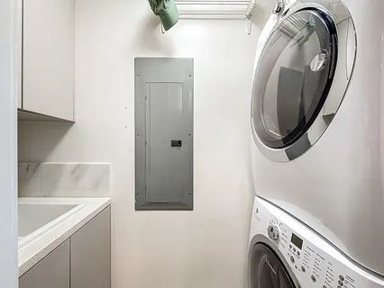 a view of a room with a bed and a shower curtain